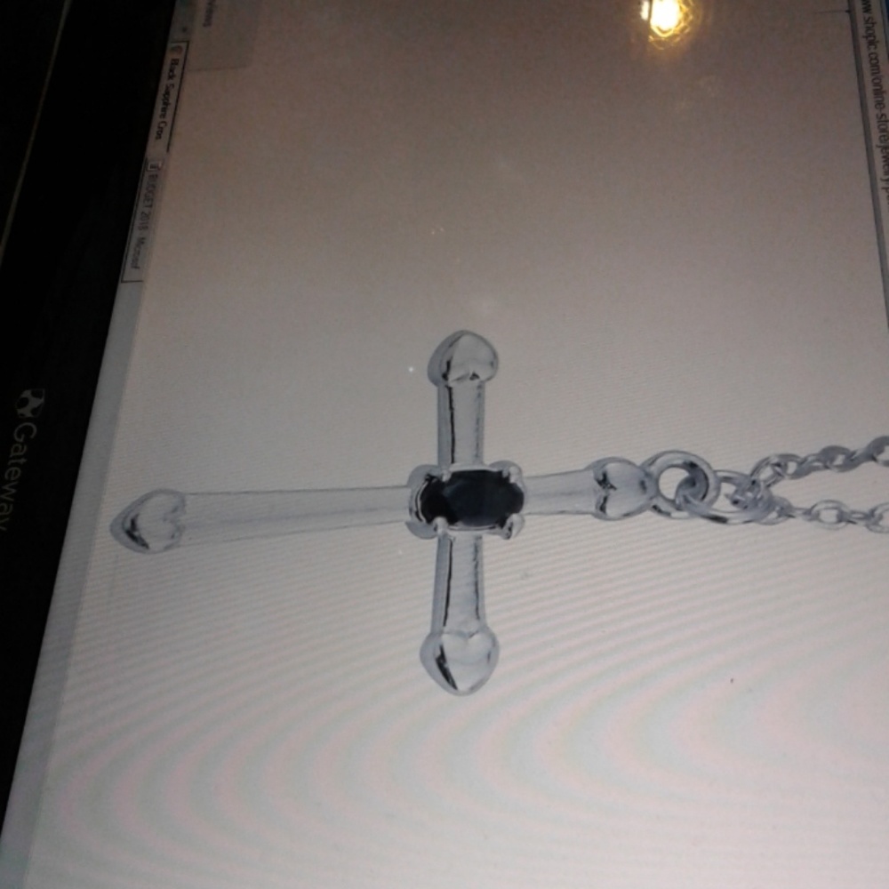 Black Sapphire cross pendant with 18 in chain
